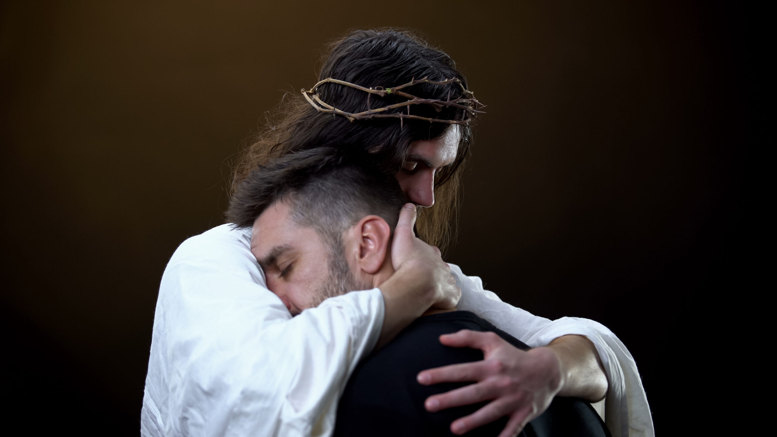 Jesus Hugs Man
